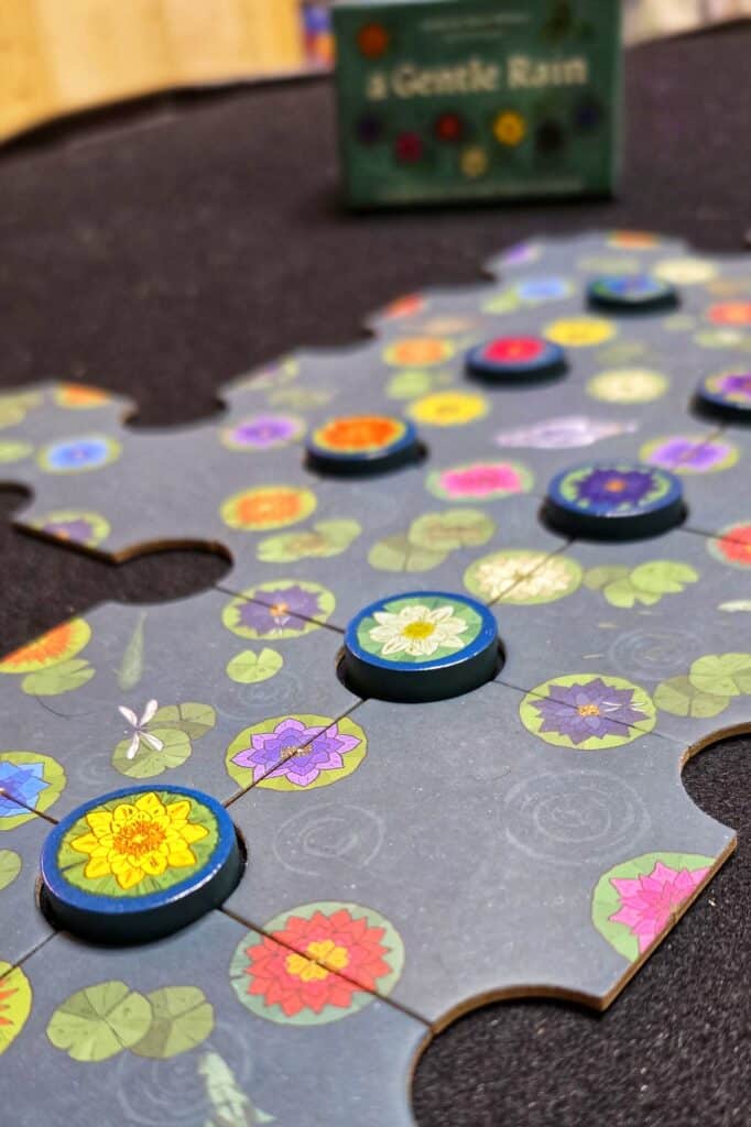 A Gentle Rain is a quick little puzzlely board game that I just love playing to wind down after a long day. It is so easy you could do it while listening to your favorite music or audiobook. It is the perfect mental reset game. To put it simply this easy solo game is a great way to relax.